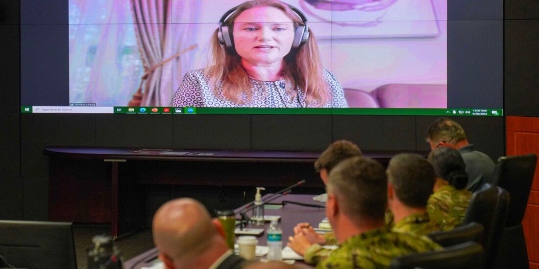 Jennifer Strong addressing a military audience via video