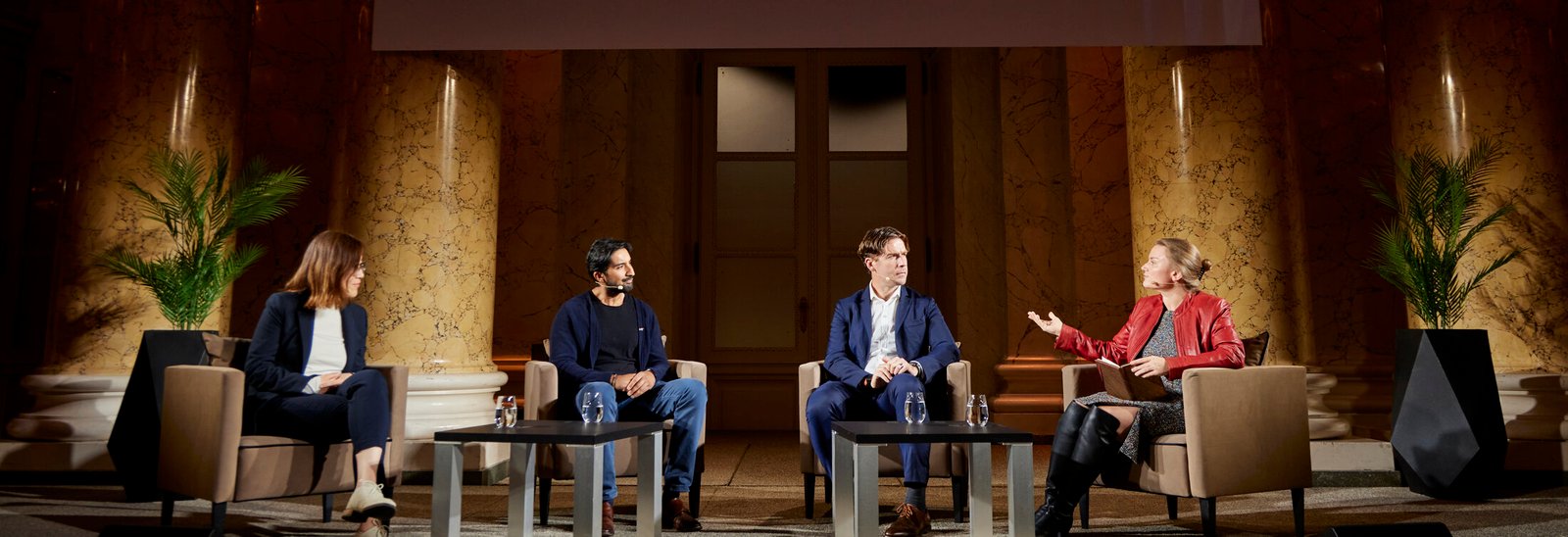 Jennifer Strong moderating the TED AI panel in Vienna